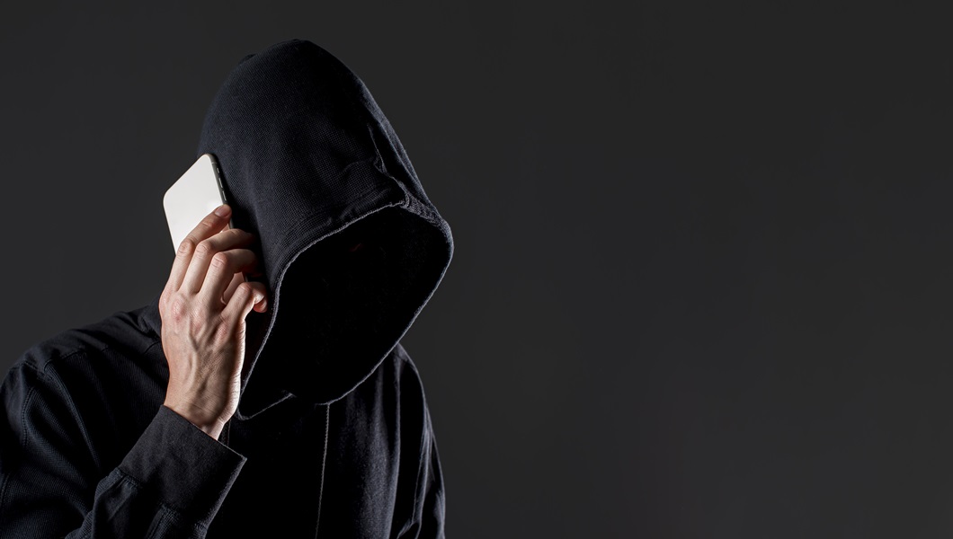 side-view-male-hacker-talking-smartphone-with-copy-space-2