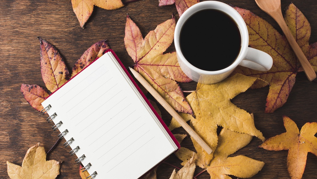 notebook-coffee-cup-autumn-leaves-background