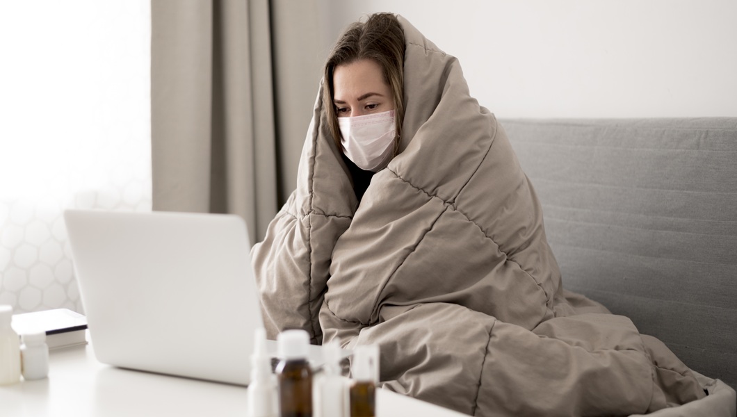 woman-wearing-medical-mask-wrapped-blanket-3