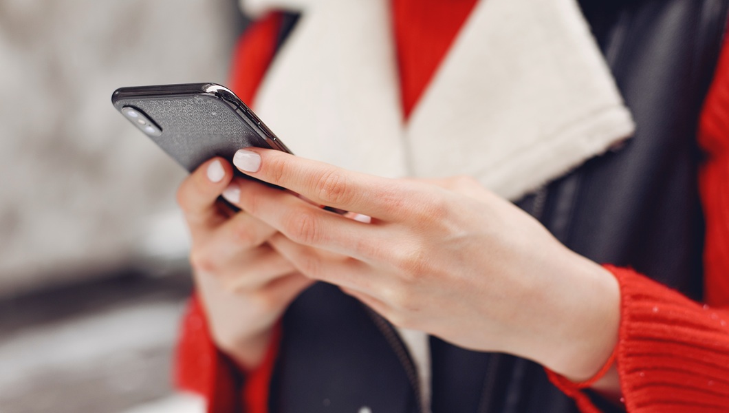 Winter time in big city of charming girl standing on street