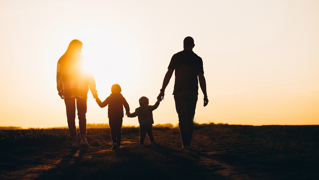 Happy family silhouette on the sunset