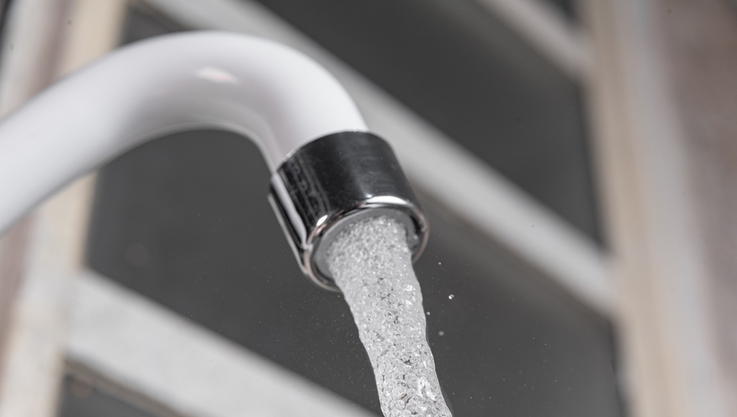 White kitchen sink faucet - Close up